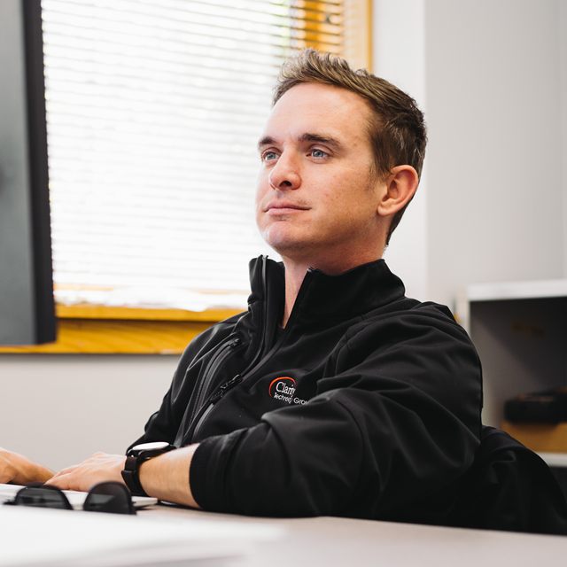 A Clarity support team member at their desk